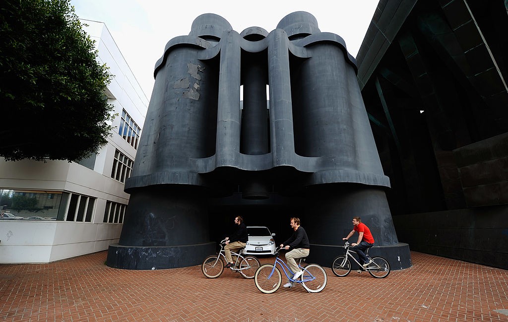 LOS ANGELES, CA - JANUARY 26: People ride bicycles past where Google will open a new office in the Binoculars Building, designed by famed architect Frank Gehry, on January 26, 2011 in Venice section of Los Angeles, California. Google representatives confirmed that the company had signed a lease for 100,000 square feet of office space in three buildings and employees would begin moving into the offices this year. Google also announced its largest hiring spree, with more than 6,000 employees to be added this year. The sculpture was created by artists Claes Oldenburg and Coosje van Bruggen. (Photo by Kevork Djansezian/Getty Images)