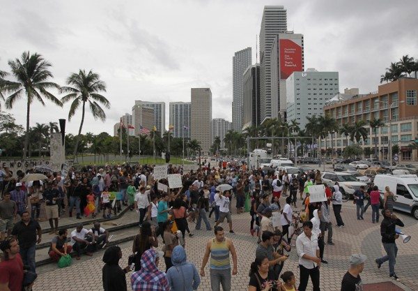 The crowd begins a short march for Trayvon Martin in Miami, Florida July 14, 2013. U.S. President Barack Obama called for calm on Sunday after the acquittal of George Zimmerman in the shooting death of black teenager Martin, as hundreds of civil rights demonstrators turned out at rallies to condemn racial profiling. REUTERS/Andrew Innerarity (UNITED STATES - Tags: POLITICS CRIME LAW CIVIL UNREST) - RTX11MZB