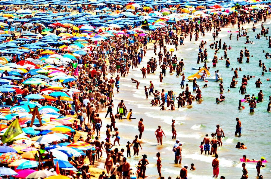 Summer Holiday Season Begins And Tourists Flock To The Beaches In Spain...BENIDORM, SPAIN - JULY 22: People sunbathe at Levante Beach on July 22, 2015 in Benidorm, Spain. Spain has set a new record for visitors, with 29.2 million visitors in June, 4.2% more than the same period in 2014. Spain is also expected to be the main destination of tourists seeking a value-for-money all-inclusive holiday after the Tunisia attack. (Photo by David Ramos/Getty Images)