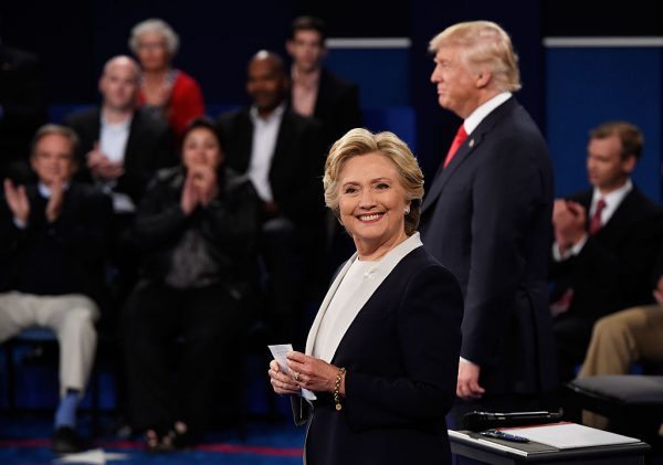 ST LOUIS, MO - OCTOBER 09: Democratic presidential nominee former Secretary of State Hillary Clinton (L) and Republican presidential nominee Donald Trump listen during the town hall debate at Washington University on October 9, 2016 in St Louis, Missouri. This is the second of three presidential debates scheduled prior to the November 8th election. (Photo by Saul Loeb-Pool/Getty Images)