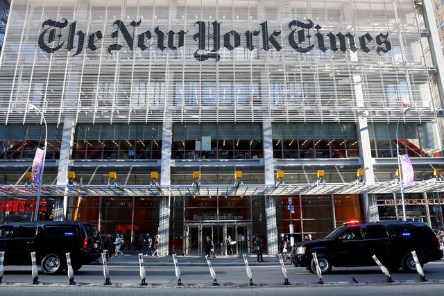 The motorcade of U.S. President-elect Donald Trump makes its way past the New York Times building after a meeting in New York U.S., November 22, 2016. REUTERS/Shannon Stapleton