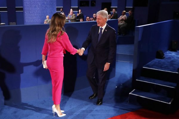 ST LOUIS, MO - OCTOBER 09: Melania Trump (L) shakes hands with former U.S. President Bill Clinton before the town hall debate at Washington University on October 9, 2016 in St Louis, Missouri. This is the second of three presidential debates scheduled prior to the November 8th election. (Photo by Chip Somodevilla/Getty Images)