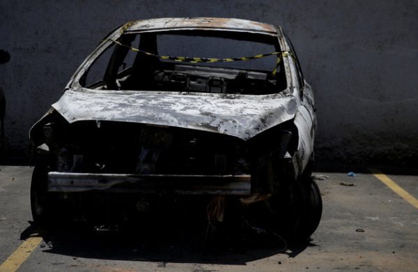 A burned car in which a body was found during searches for the Greek Ambassador for Brazil Kyriakos Amiridis, is pictured at a police station in Belford Roxo, Brazil December 30, 2016. REUTERS/Ricardo Moraes