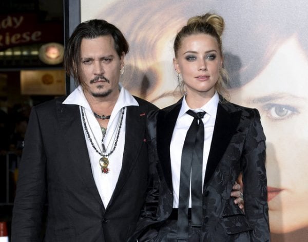 FILE PHOTO -- Cast member Amber Heard and husband Johnny Depp pose during the premiere of the film "The Danish Girl," in Los Angeles, California November 21, 2015. REUTERS/Kevork Djansezian/File Photo
