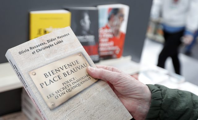 A copy of the book "Bienvenue Place Beauvau" by Olivia Recasens, Didier Hassoux and Christophe Labbe is displayed a the 2017 Paris Book Fair, France, March 24, 2017. REUTERS/Charles Platiau