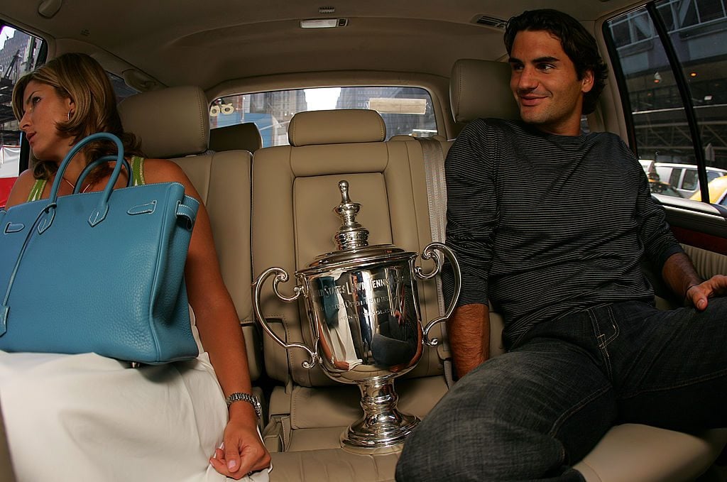 NEW YORK- SEPTEMBER 12: Roger Federer is seen in a car with his girlfriend Mirka Vavrinec as he rides to various media appearances with his US Open trophy following his victory last night in the 2005 US Open Tennis Championship September 12, 2005 in New York City. (Photo by Chris Trotman/Getty Images)