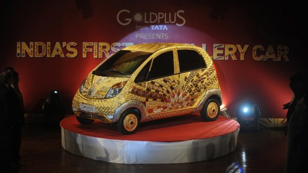 A custom Tata Motors' 'Nano' car, is seen adorned in gold, silver and gemstone trimmings during its unveiling in Mumbai on September 19, 2011. The World's first Gold jewellery car, claimed by Tata, is made from 80 kilograms of 22 karat gold, 15 kilograms of silver, and numerous gemstones. AFP PHOTO/ Punit PARANJPE (Photo credit should read PUNIT PARANJPE/AFP/Getty Images)