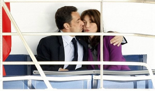 LONDON - MARCH 27: French President Nicolas Sarkozy kisses his wife Carla Bruni-Sarkozyas they sit on the back of the Clipper Aurora headed for Greenwich on March 27, 2008 in London, England. President Nicolas Sarkozy and wife Carla Bruni-Sarkozy are on a two day state visit to London and Windsor. (Photo by Daniel Berehulak/Getty Images)