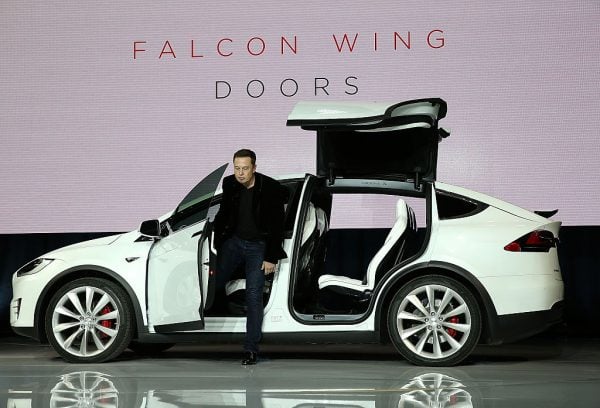 FREMONT, CA - SEPTEMBER 29: Tesla CEO Elon Musk demonstrates the falcon wing doors on the new Tesla Model X Crossover SUV during a launch event on September 29, 2015 in Fremont, California. After several production delays, Elon Musk officially launched the much anticipated Tesla Model X Crossover SUV. The (Photo by Justin Sullivan/Getty Images)