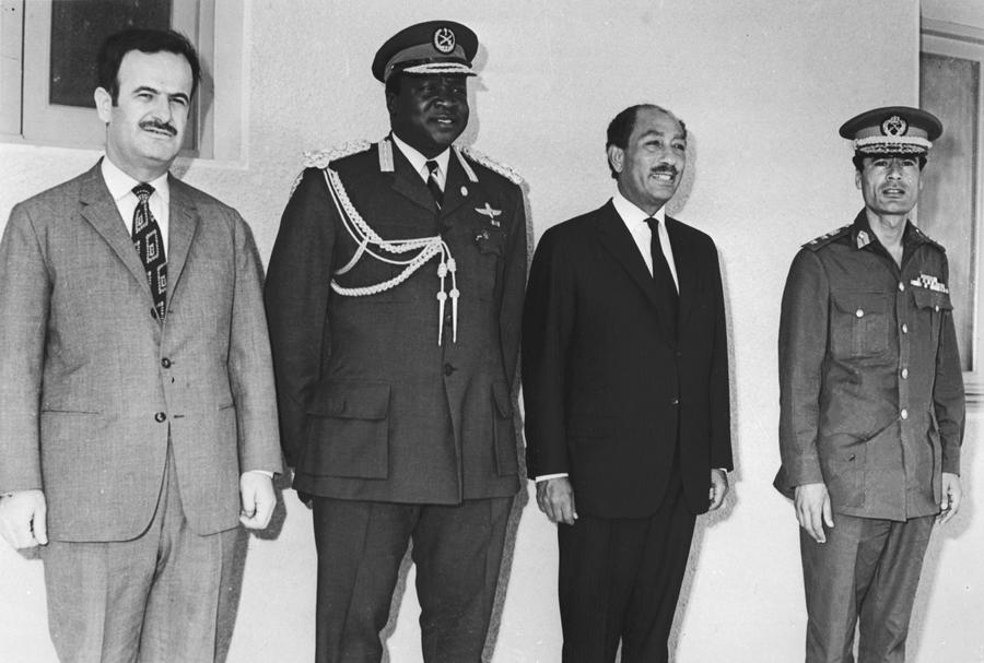 (FILES) A picture taken 26 June 1972 shows (from L) Syrian President Hafez al-Assad, President of Uganda Idi Amin Dada, Egyptian President Anwar El Sadat and Lybian leader Muammar Kadhafi in Kampala during an OUA summit. Hafez al-Assad died 10 June 2000 in the morning, diplomatic sources said.