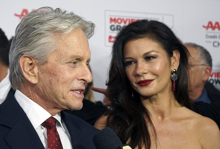 epa05150639 British actress Catherine Zeta-Jones (R) and her husband US actor Michael Douglas arrive for the AARP's 15th Annual Movies For Grownups Awards at the Beverly Wilshire Four Seasons Hotel in Beverly Hills, California, USA, 08 February 2016. EPA/NINA PROMMER