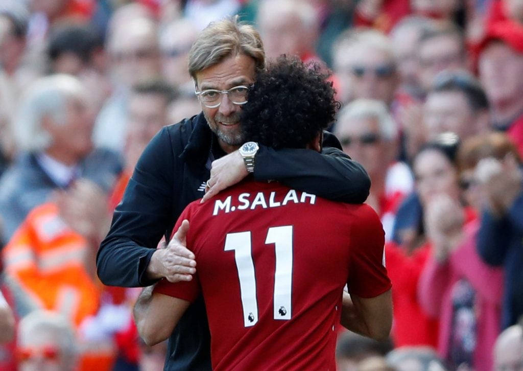Soccer Football - Premier League - Liverpool vs Brighton & Hove Albion - Anfield, Liverpool, Britain - May 13, 2018 Liverpool's Mohamed Salah is hugged by manager Juergen Klopp as he is substituted Action Images via Reuters/Carl Recine EDITORIAL USE ONLY. No use with unauthorized audio, video, data, fixture lists, club/league logos or "live" services. Online in-match use limited to 75 images, no video emulation. No use in betting, games or single club/league/player publications. Please contact your account representative for further details.