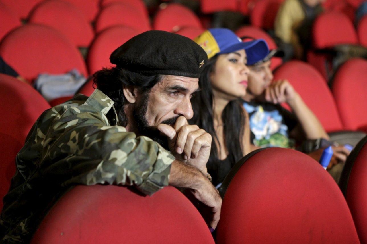Humberto Lopez, known as "El Che", reacts as National Electoral Council (CNE) President Tibisay Lucena announces the official results of parliamentary elections in Caracas, December 7, 2015. Venezuela's opposition won control of the legislature from the ruling Socialists for the first time in 16 years on Sunday, giving them a long-sought platform to challenge President Nicolas Maduro. REUTERS/Marco Bello FOR EDITORIAL USE ONLY. NO RESALES. NO ARCHIVE.