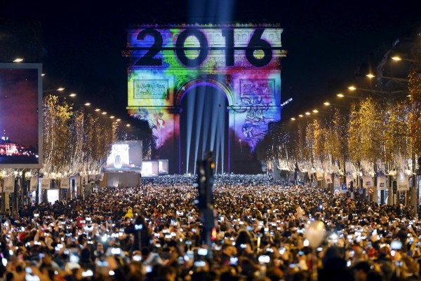 Revellers gather near the Arc de Triomphe on the Champs Elysees Avenue in Paris, France, during New Year celebrations, early January 1, 2016.  REUTERS/Charles Platiau