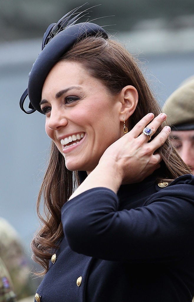 WINDSOR, ENGLAND - JUNE 25:  Catherine, Duchess of Cambridge presents medals to members of the Irish Guards at the Victoria Barracks on June 25, 2011 in Windsor, England. The Duchess of Cambridge and Duke of Cambridge are at the barracks to present service medals to members of the Irish Guards  (Photo by Chris Jackson/Getty Images)