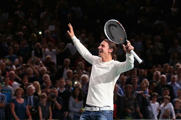 PARIS, FRANCE - NOVEMBER 02:  Footballer Zlatan Ibrahimovic celebrates winning a point in a game with Novak Djokovic of Serbia after the match against Roger Federer of Switzerland during day six of the BNP Paribas Masters at Palais Omnisports de Bercy on November 2, 2013 in Paris, France.  (Photo by Julian Finney/Getty Images)