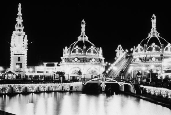 Luna Park on Coney Island, New York, lit up at night and advertising the attractions of the 'Human Dynamo'. (Photo by Hulton Archive/Getty Images)
