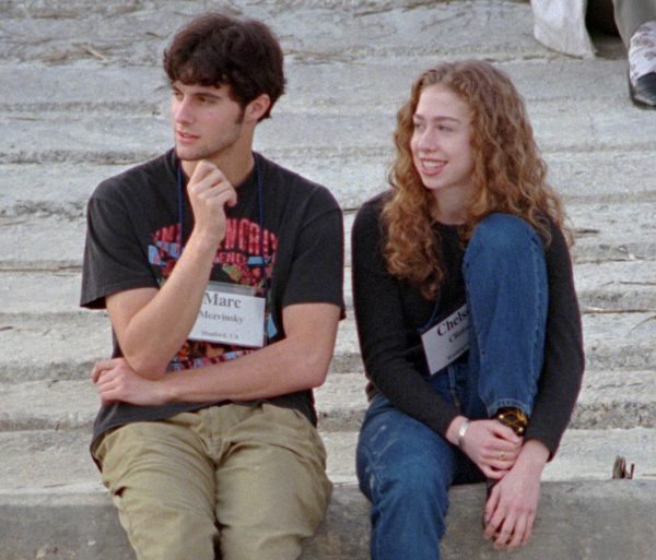 In this Dec. 1996 file photo, Chelsea Clinton, right, sits with Marc Mezvinsky on the beach at Hilton Head Island, S.C. (AP Photo/Mary Ann Chastain, File)