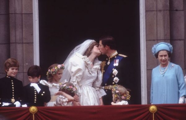 29th July 1981: Prince Charles, Prince of Wales, kissing his wife Princess Diana (1961 - 1997) on the balcony of Buckingham Palace in London after their marriage. (Photo by Hulton Archive/Getty Images)
