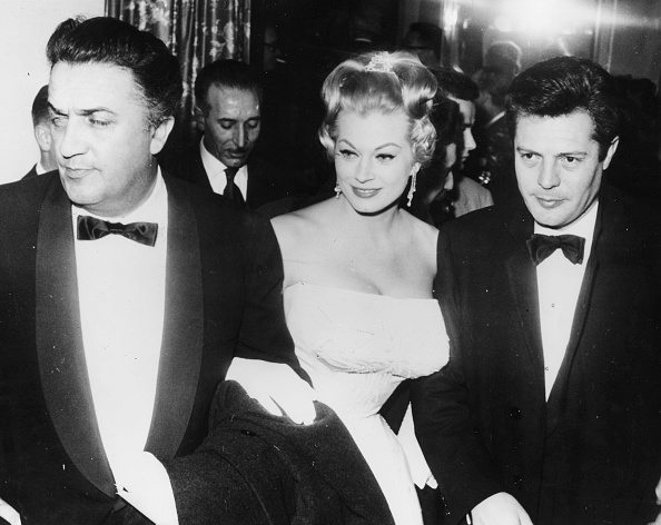 Film director Federico Fellini (left) with actors Anita Ekberg and Marcello Mastroianni at the premiere of the film 'La Dolce Vita' in Rome, February 8th 1960. (Photo by Keystone/Hulton Archive/Getty Images)