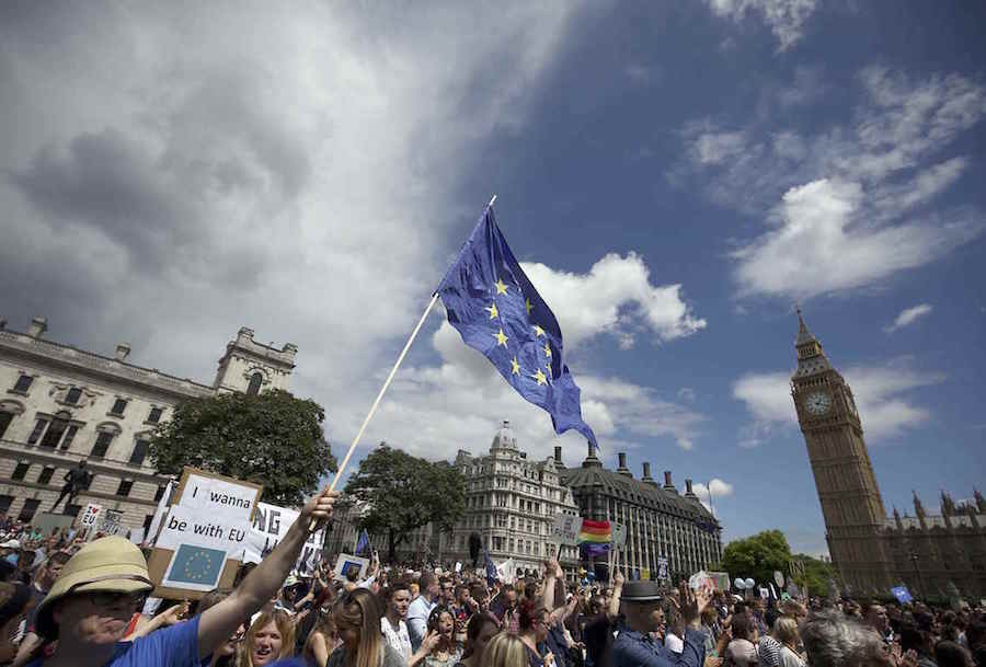 A man holds a European Union flag in Parliament Square during a 'March for Europe' demonstration against Britain's decision to leave the European Union, central London