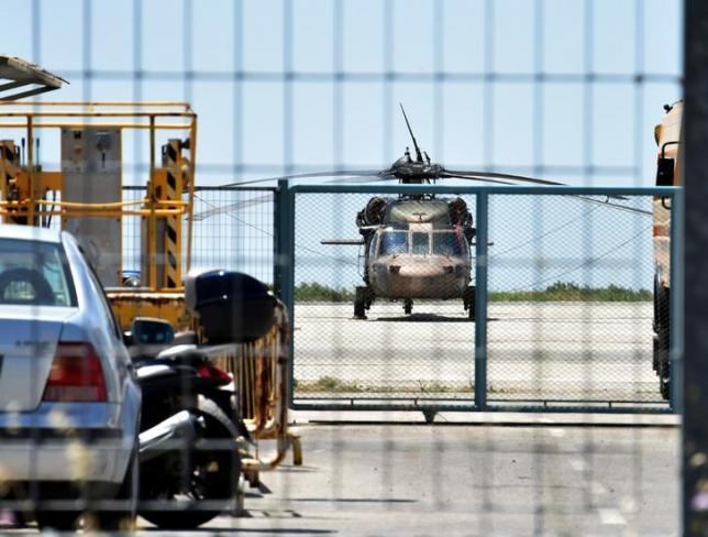 A Turkish military helicopter lands in the northern Greek city of Alexandroupolis with eight men on board who have requested political asylum after the attempted coup in Turkey, July 16, 2016. Eurokinissi/Panagiota Tsikaki/via REUTERS