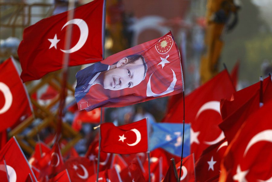 A flag with the picture of Turkey's President Erdogan is seen during the Democracy and Martyrs Rally in Istanbul