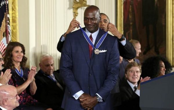 U.S. President Barack Obama awards NBA star Michael Jordan the Presidential Medal of Freedom during a ceremony in the East Room of  the White House in Washington, U.S., November 22, 2016.       REUTERS/Yuri Gripas