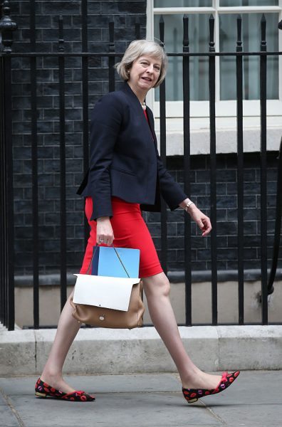 LONDON, ENGLAND - JULY 08: Home Secretary Theresa May leaves 10 Downing Street on July 8, 2015 in London, England. Today Chancellor George Osborne is presenting his summer budget to Parliament and is expected to announce £12 billion in welfare cuts. (Photo by Peter Macdiarmid/Getty Images)
