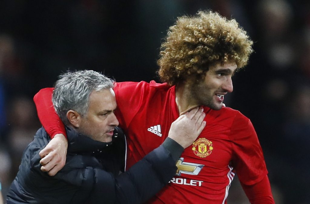 Britain Football Soccer - Manchester United v Hull City - EFL Cup Semi Final First Leg - Old Trafford - 10/1/17 Manchester United's Marouane Fellaini celebrates scoring their second goal with manager Jose Mourinho Action Images via Reuters / Jason Cairnduff Livepic EDITORIAL USE ONLY. No use with unauthorized audio, video, data, fixture lists, club/league logos or "live" services. Online in-match use limited to 45 images, no video emulation. No use in betting, games or single club/league/player publications. Please contact your account representative for further details.