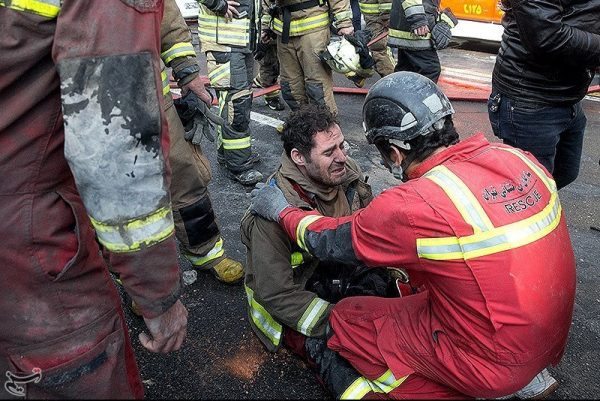 A firefighter reacts at the site of a blazing high-rise building in Tehran, Iran January 19, 2017. Tasnim News Agency/Handout via REUTERS ATTENTION EDITORS - THIS PICTURE WAS PROVIDED BY A THIRD PARTY. FOR EDITORIAL USE ONLY. NO RESALES. NO ARCHIVE.