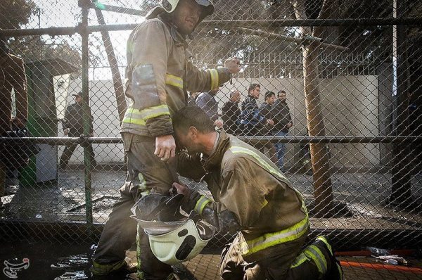 A firefighter reacts at the site of a blazing high-rise building in Tehran, Iran January 19, 2017. Tasnim News Agency/Handout via REUTERS ATTENTION EDITORS - THIS PICTURE WAS PROVIDED BY A THIRD PARTY. FOR EDITORIAL USE ONLY. NO RESALES. NO ARCHIVE.