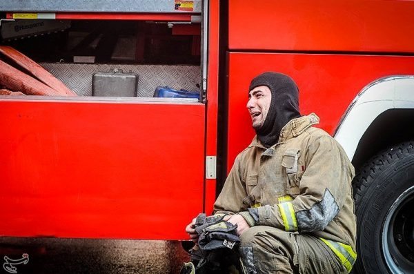 A firefighter reacts at the site of a collapsed high-rise building in Tehran, Iran January 19, 2017. Tasnim News Agency/Handout via REUTERS ATTENTION EDITORS - THIS PICTURE WAS PROVIDED BY A THIRD PARTY. FOR EDITORIAL USE ONLY. NO RESALES. NO ARCHIVE.