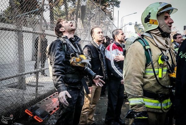 A man reacts at the site of a collapsed high-rise building in Tehran, Iran January 19, 2017. Tasnim News Agency/Handout via REUTERS ATTENTION EDITORS - THIS PICTURE WAS PROVIDED BY A THIRD PARTY. FOR EDITORIAL USE ONLY. NO RESALES. NO ARCHIVE.