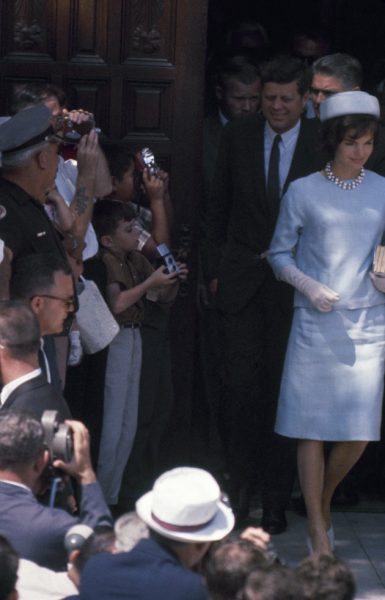 American President John F. Kennedy (1917 - 1963) & his wife, First Lady Jacqueline Kennedy 1929 - 1994), smile at the crowd as they leave St. Edwards Church after a service, Palm Beach, Florida, April 3, 1961. (Photo by Joseph Scherschel/The LIFE Picture Collection/Getty Images)