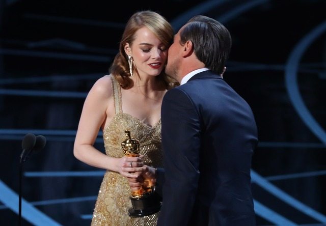 89th Academy Awards - Oscars Awards Show - Best Actress winner Emma Stone is congratulated by Leonardo DiCaprio as shes accept her award for La La Land. REUTERS/Lucy Nicholson