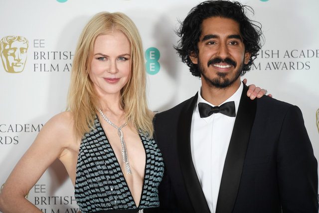 Presenters Nicole Kidman and Dev Patel pose after presenting an award at the British Academy of Film and Television Awards (BAFTA) at the Royal Albert Hall in London, Britain, February 12, 2017. REUTERS/Toby Melville