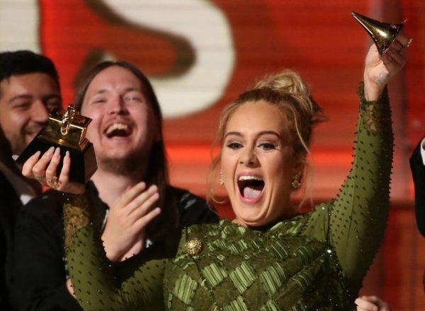 Adele breaks the Grammy for Record of the Year for "Hello" after having it presented to her at the 59th Annual Grammy Awards in Los Angeles, California, U.S., February 12, 2017. REUTERS/Lucy Nicholson TPX IMAGES OF THE DAY TPX IMAGES OF THE DAY