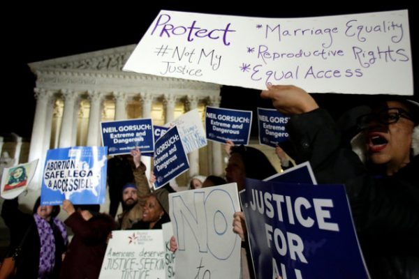 Protesters rally outside the Supreme Court against President Donald Trump's Supreme Court nominee Neil Gorsuch in Washington, U.S., January 31, 2017. REUTERS/Yuri Gripas