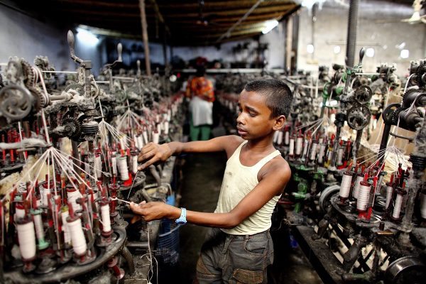 13 year old Sobuj works in a textile factory in conditions of extreme heat and noise. For this he earns about 1200 Taka a month (£10.00 GBP).
