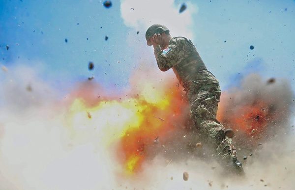 REFILE - CORRECTING RESTRICTIONSATTENTION EDITORS - VISUALS COVERAGE OF SCENES OF DEATH OR INJURY A mortar tube accidentally explodes, killing four Afghan soldiers and U.S. Army photographer who took the photo, Spc. Hilda I. Clayton, during an Afghan National Army (ANA) live-fire training exercise in Laghman Province, Afghanistan July 2, 2013. The 2013 photo was released for the May-June issue of the United States Army journal Military Review. U.S. Army/Spc. Hilda Clayton/Handout via REUTERS ATTENTION EDITORS - THIS PICTURE WAS PROVIDED BY A THIRD PARTY. FOR EDITORIAL USE ONLY. TPX IMAGES OF THE DAY