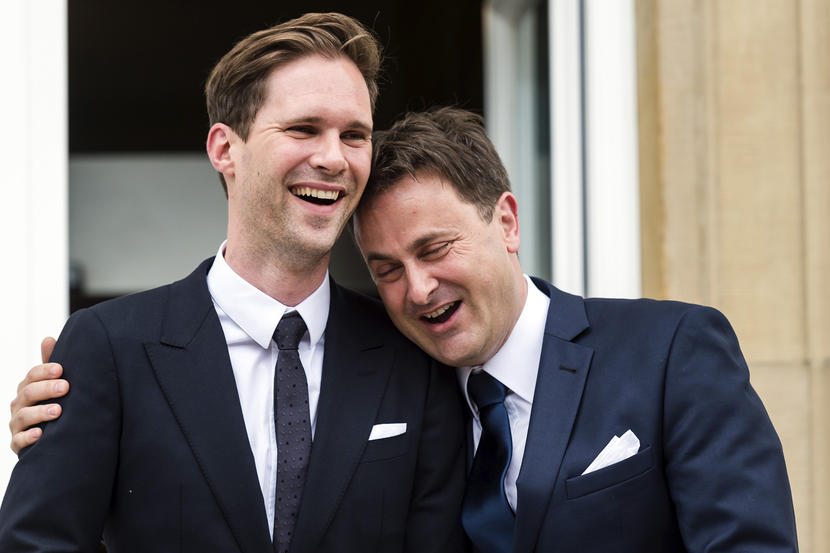 Luxembourg's Prime Minister Xavier Bettel, right, puts his hand around the shoulder of his partner Gauthier Destenay after their marriage at the town hall in Luxembourg, on Friday, May 15, 2015. The marriage comes one year after the parliament approved legislation to turn Luxembourg into an increasing number of countries allowing for same-sex marriages. Bettel and Destenay have been civil partners since 2010. (AP Photo/Geert Vanden Wijngaert)