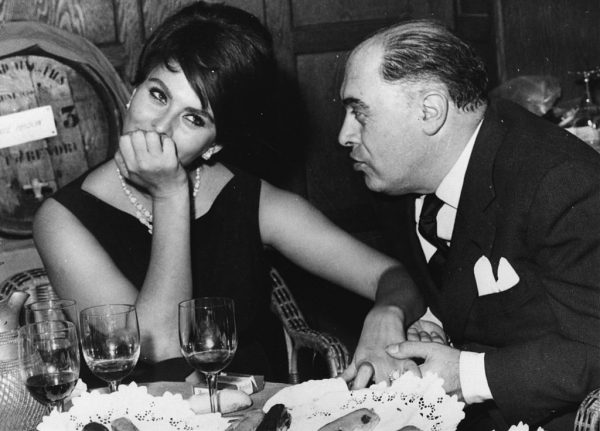 Italian film actress Sophia Loren in a restaurant in France with her husband Carlo Ponti, the man credited with discovering her. (Photo by Keystone/Getty Images)