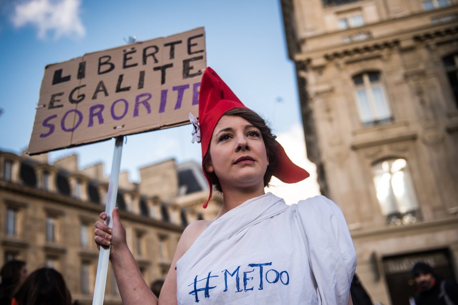 epa06350180 A feminist activist wears as 'Marianne' costume symbol of the French Republic, with the #MeToo hastag holds a poster reading 'Liberty Equality Sisterhood' during the International Day for the Elimination of Violence Against Women march in Paris, France, 25 November 2017. The United Nations General Assembly has designated November 25 as the International Day for the Elimination of Violence Against Women in an effort to raise awareness of the fact that women around the world are subject to rape, domestic violence and other forms of violence. EPA/CHRISTOPHE PETIT TESSON