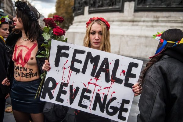 epa06350177 Inna Shevchenko (C) holds a poster readings 'Female Revenge' with Activists from the Ukrainian feminist group FEMEN during the International Day for the Elimination of Violence Against Women march in Paris, France, 25 November 2017. The United Nations General Assembly has designated November 25 as the International Day for the Elimination of Violence Against Women in an effort to raise awareness of the fact that women around the world are subject to rape, domestic violence and other forms of violence. EPA/CHRISTOPHE PETIT TESSON