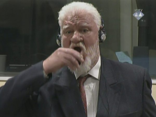 A wartime commander of Bosnian Croat forces, Slobodan Praljak, is seen during a hearing at the U.N. war crimes tribunal in the Hague, Netherlands, November 29, 2017. ICTV via REUTERS TV ATTENTION EDITORS - THIS IMAGE WAS PROVIDED BY A THIRD PARTY.