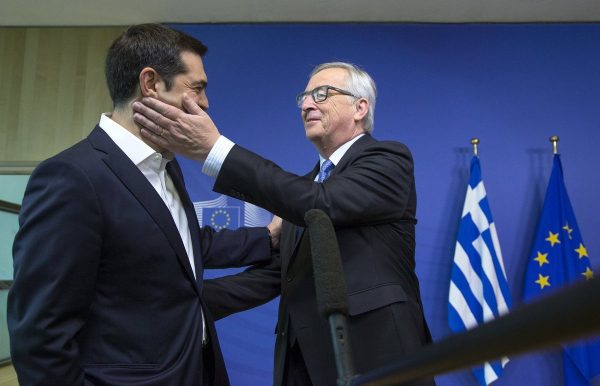 Greek Prime Minister Alexis Tsipras (L) is welcomed by European Commission President Jean-Claude Juncker for a meeting ahead of a Eurozone emergency summit on Greece in Brussels, Belgium June 22, 2015. The European Union welcomed new proposals from Tsipras as a "good basis for progress" at talks on Monday where creditors want 11th-hour concessions to haul Athens back from the brink of bankruptcy. REUTERS/Yves Herman TPX IMAGES OF THE DAY