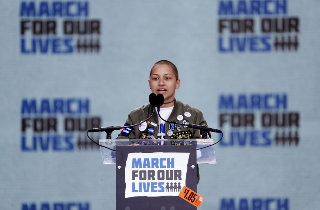 Emma Gonzalez, a student and shooting survivor from the Marjory Stoneman Douglas High School in Parkland, Florida, addresses the conclusion of the "March for Our Lives" event demanding gun control after recent school shootings at a rally in Washington, U.S., March 24, 2018. REUTERS/Aaron P. Bernstein