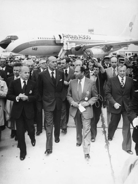 French President Valery Giscard d'Estaing (centre left) talking to entrepreneur Serge Dassault (centre right) at the opening of the International Exhibition of Aeronautics and Space, circa 1978. (Photo by Keystone/Hulton Archive/Getty Images) 