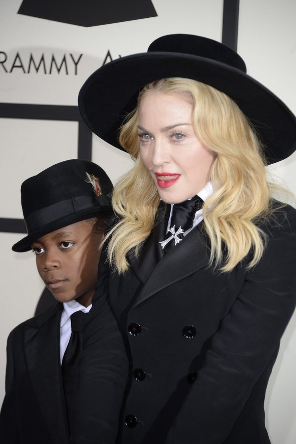 epa05749542 (FILE) - A file photo dated 26 January 2014 shows US singer and actress Madonna (R) and son, David Banda Mwale (L) arrive for the 56th annual Grammy Awards held at the Staples Center in Los Angeles, California, USA. According to news reports on 25 January 2017, Madonna has applied for the adoption of two more children from Malawi. EPA/MICHAEL NELSON *** Local Caption *** 51198404